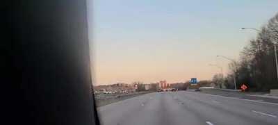 Doing Doughnuts on the Beltway Near Washington, DC While Traffic Piles up Behind Them