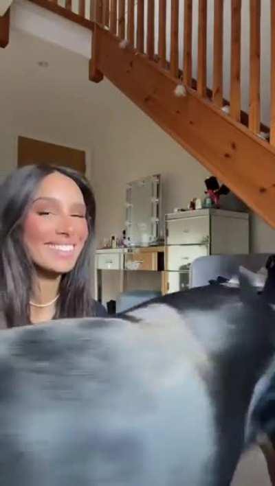 Does she kiss her dog too much?