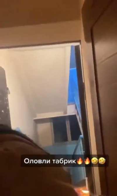 Putting a birthday flair near balloons