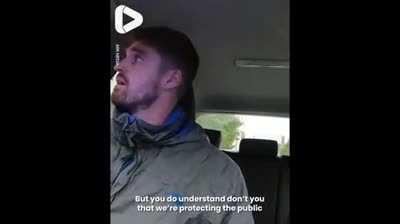 UK Police arresting a taxi driver for driving a car similar to a criminal