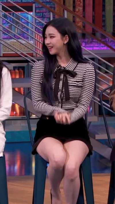 just Karina sitting down and being a feast for the eyes