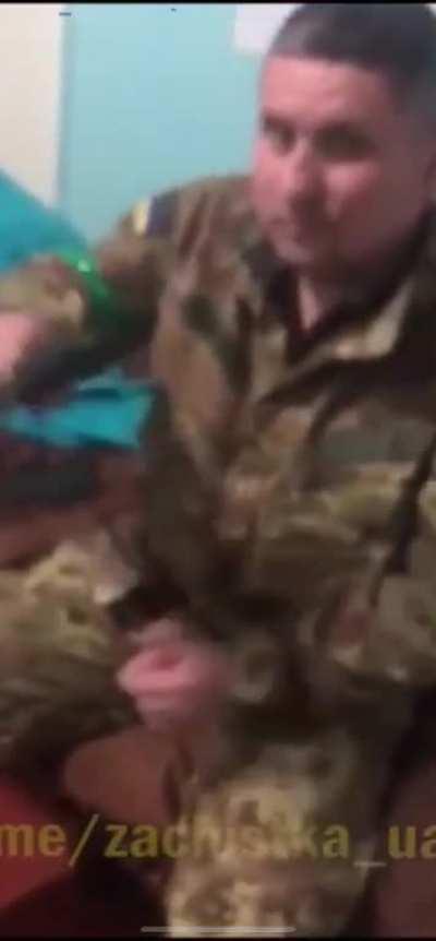 Ukrainian soldier shows how to handle a pistol