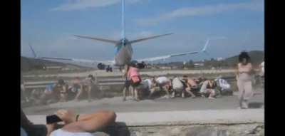 Standing behind an airplane