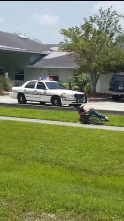 Cops driving on a sidewalk to deliberately ram a cyclist from behind