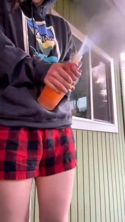 My girlfriend opening one of my bottles that I took on a trip from sea level to 6000 ft back to sea level