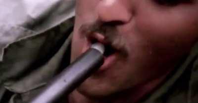 American soldiers in Vietnam smoking Marijuana out of the barrel of a Shotgun, 1970.