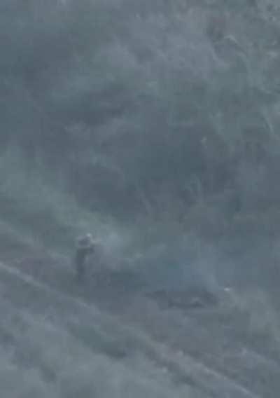 A fighter of the K2 unit shoots a Russian military man who has entered the rear of the Ukrainian positions at point-blank range