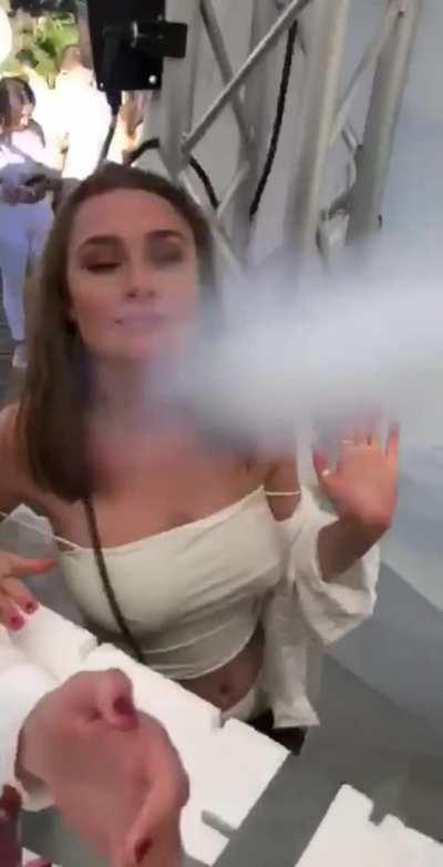 Party girl has her shirt blown down, bare tits exposed