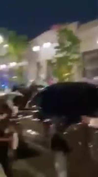 Chicago, IL: an officer runs through the crowd of his colleagues to push down a protestor and starts beating him.