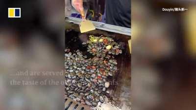 Stir-fried pebbles sold as popular street food in China