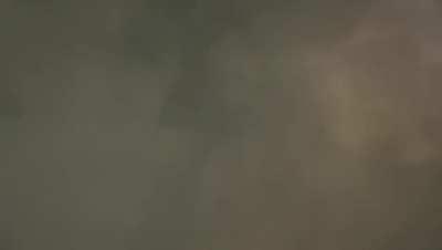 Triangle thing behind cloud in China