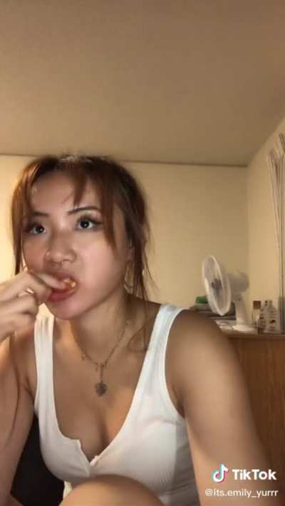 just a girl eating chicken wing in one slurp