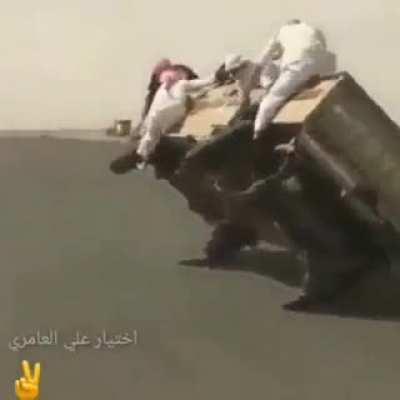 Changing a tire while driving on two wheels. Absolutely insane