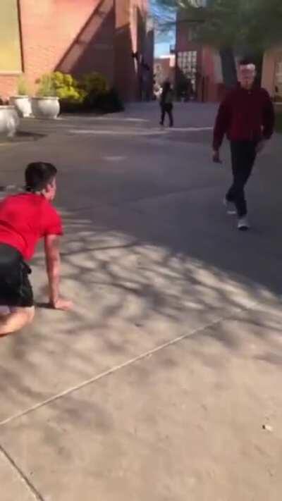 Leashed guy walks on his fours around college campus barking at other students like a dog