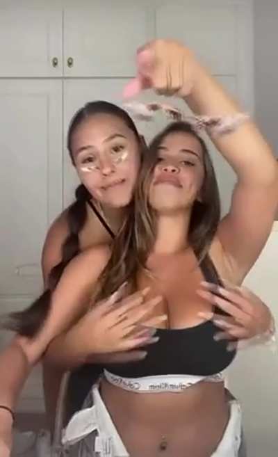Exposing her busty friend