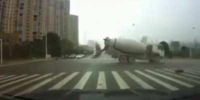 Cement truck slams into an ambulance, causing the patient to be ejected out the back of the ambulance