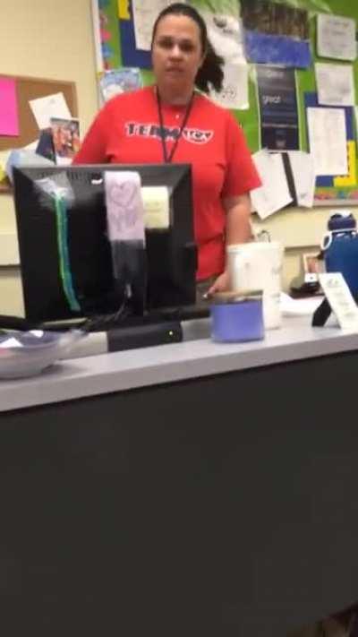 Student hides under desk and grabs teacher's ankle