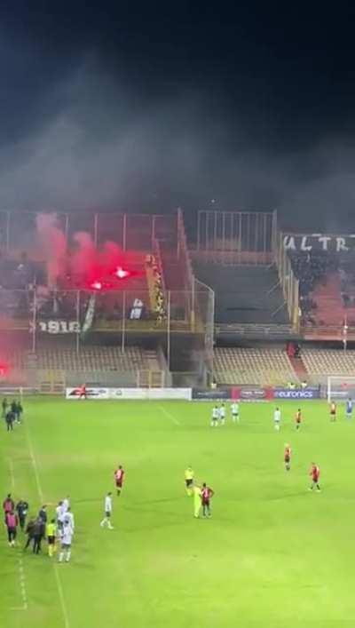 Rival Italian ultras throwing flares at each other