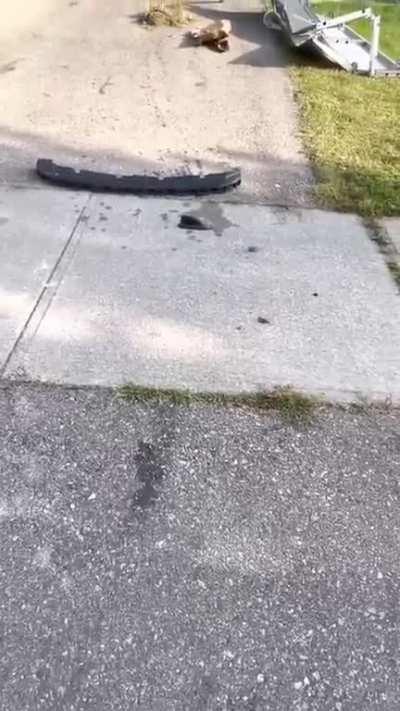 Woman rams her car into a house, it then catches fire before becoming fully engulfed in flames