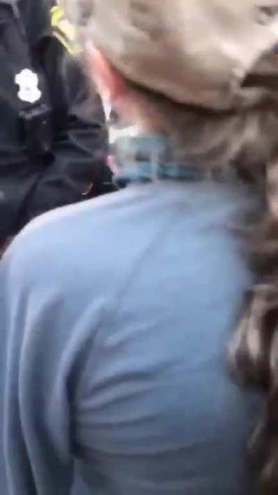 CINCINNATI POLICE SHOWN WITH PROTESTOR UNCONSCIOUS AT THE JUSTICE CENTER AFTER BEING REFUSED WATER AND FOOD