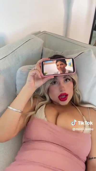 Her nip is literally slipping out 