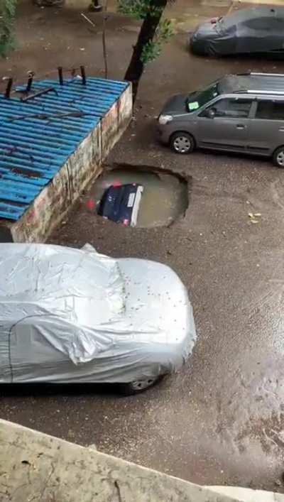 This car in a sinkhole