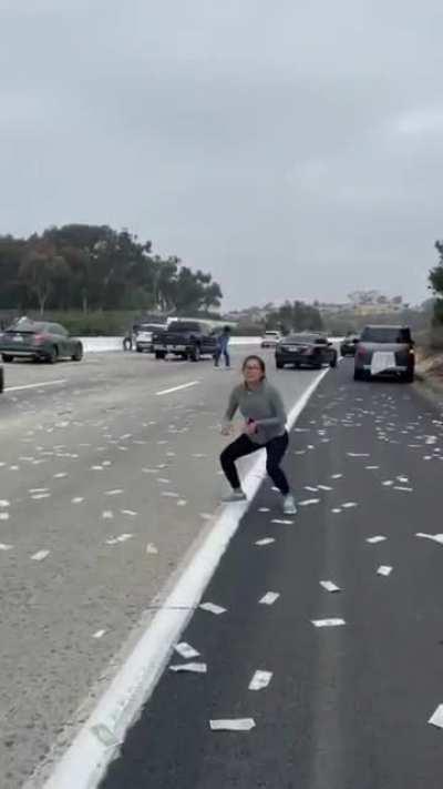Money rained on roadway.