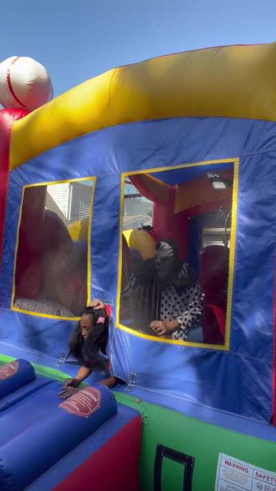 Mr. Clown never had a dark skin Asian girl in his bounce house before so he had to try.