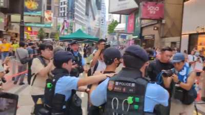 A young man holding a copy of 