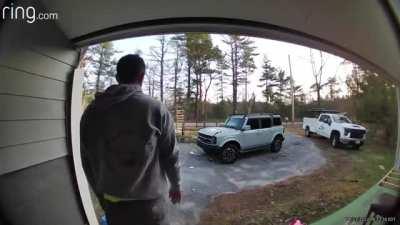 Man tries to throw bag into garbage, it tears midair