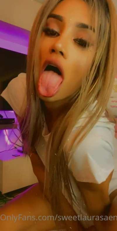 Laura tries her best to hide that huge thing