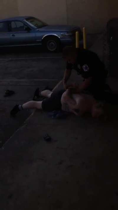 White officer sees white guy on phone after pulling over black guy. White officer goes over to white guy on phone grabs him, throws him to the ground and knees him, while down in the head This is in BAYTOWN, Tx TODAY