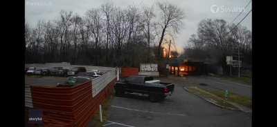 Garbage truck hits overpass and explodes