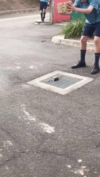 Smashing a soda can with a brick