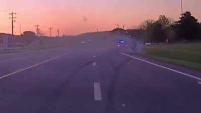 Crazy footage of a PIT maneuver resulting in the police car flying over the suspect and taking out multiple light poles