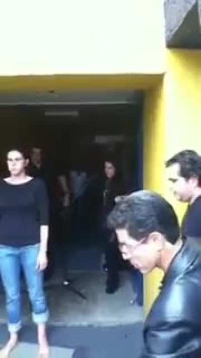 A latina woman walks on hot coals