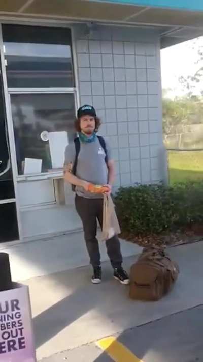 Man confronts a KKK drug dealer pimp sitting outside a gas station.