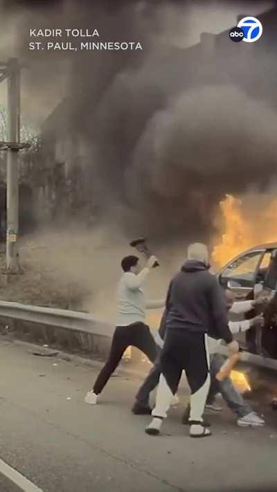 The moment a group of good Samaritans rushed to rescue a driver from a burning car after a crash in Minnesota.