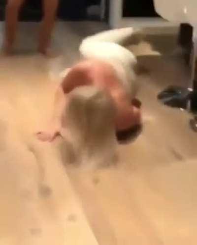 Hand-stand to over-the-shoulder face slam