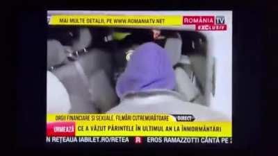 Andrew Tate being arrested following a raid by police in Romania