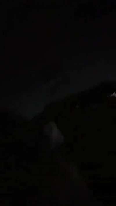 Girl, balloons and power lines