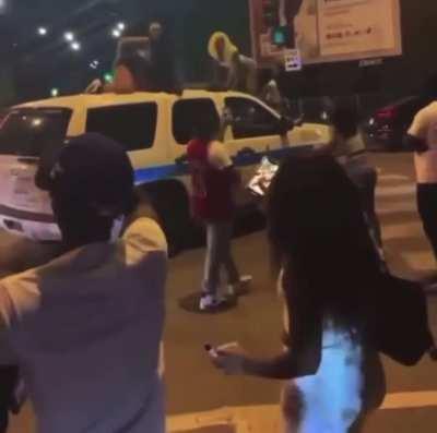 Twerking on a cop car..