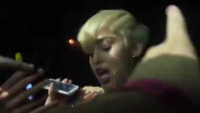 Miley let’s some lucky fans touch her hot body