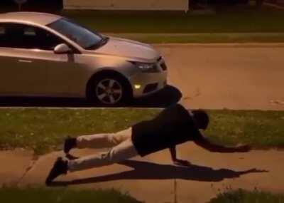 Man does a full frontal flip from an incline plank position