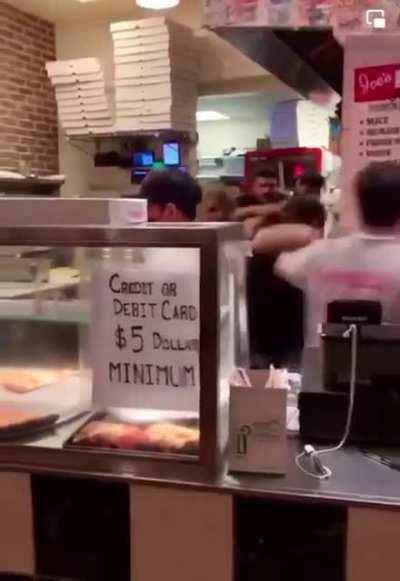 brawl breaks out inside of pizzeria