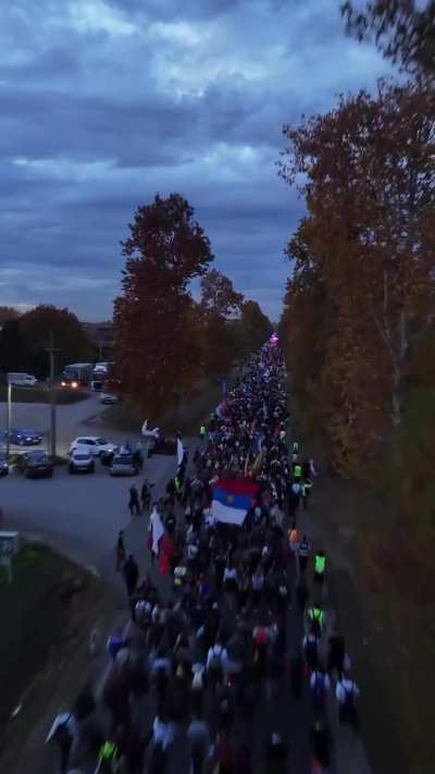 Thousands of Serbian students are marching 100 km on foot to Novi Sad to commemorate the deaths of 16 people who were killed when the train station collapsed on them on November 1st, 2024. They are also demanding accountability from the officials who appr