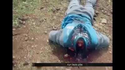 Showing off dead enemy militants