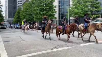 An urban trail riding club, Nonstop Riders, arrived at a downtown Houston march Tuesday afternoon to protest George Floyd's death