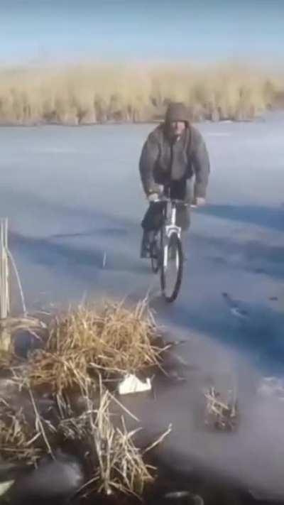 WCGW riding a bike on a frozen river