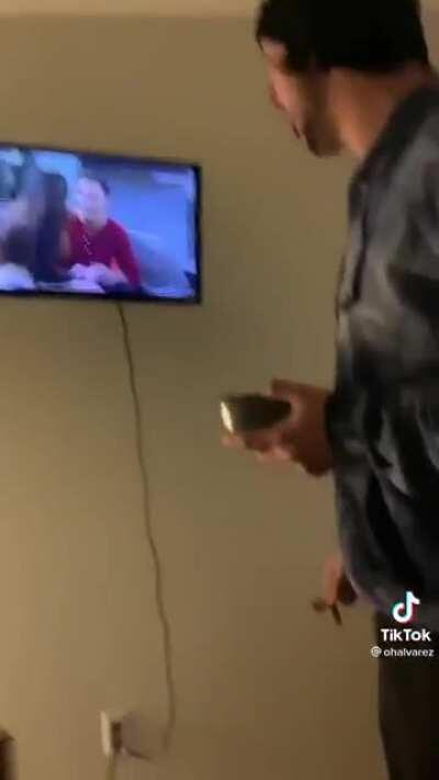 Man fixes broken tv screen by stabbing it